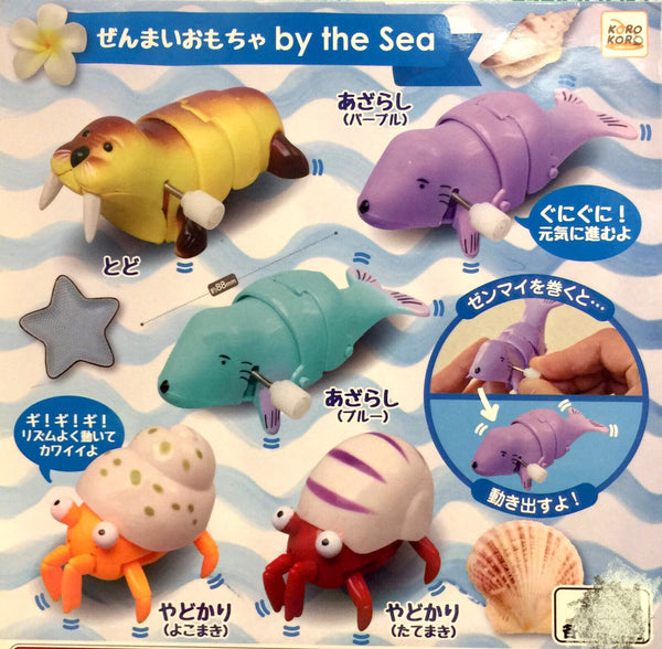 Wind-Up Figures by the sea